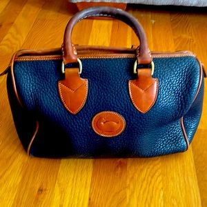 Vintage Dooney and Bourke Navy with tan trim satchel.